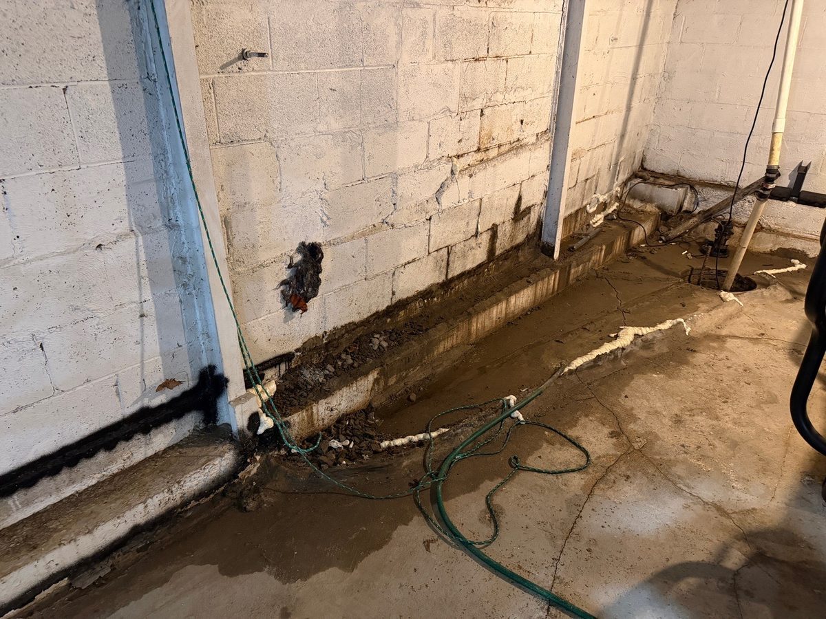 Active water intrusion on a masonry block basement wall found during a home inspection in Belton, MO