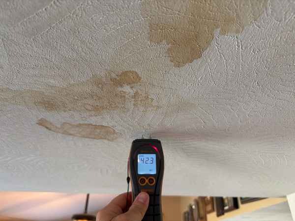 Ceiling stain with elevated moisture reading found during a home inspection in Blue Springs, MO