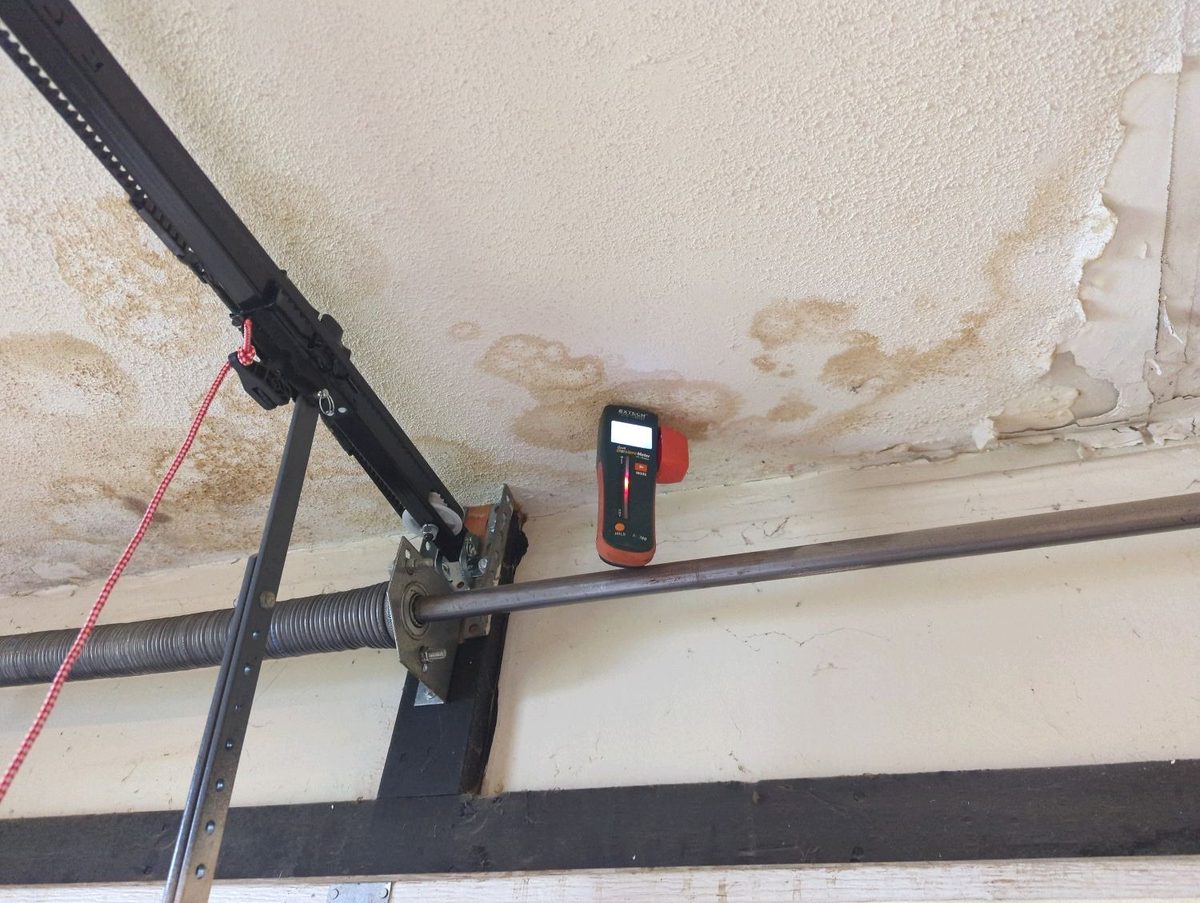 Water stains and peeling drywall tape on a garage ceiling found during a home inspection in Bonner Springs, KS