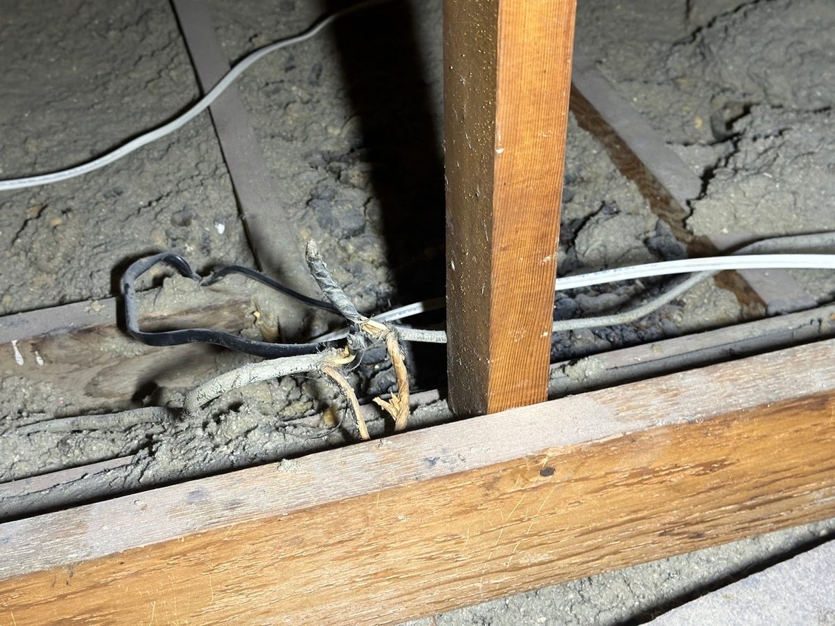 Open wire splices on older attic wiring found during a home inspection in Gladstone, MO
