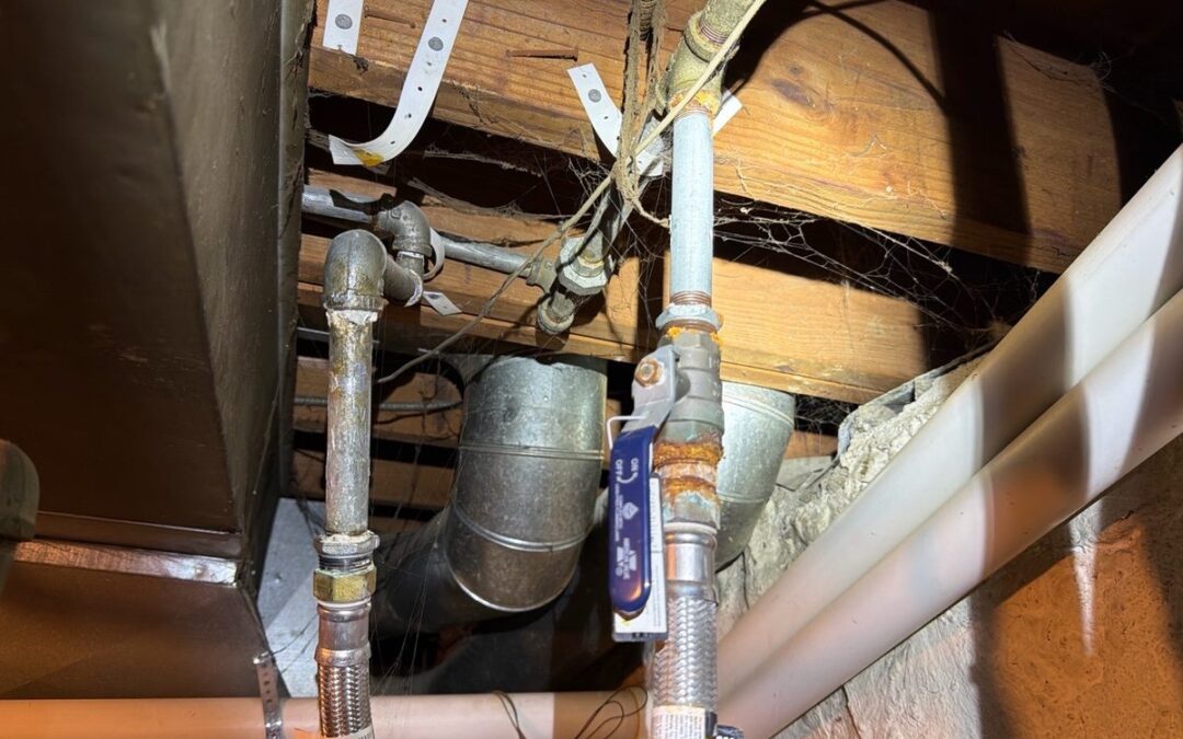 Rust and corrosion on galvanized water supply piping at a shutoff valve found during a home inspection in Kansas City, KS