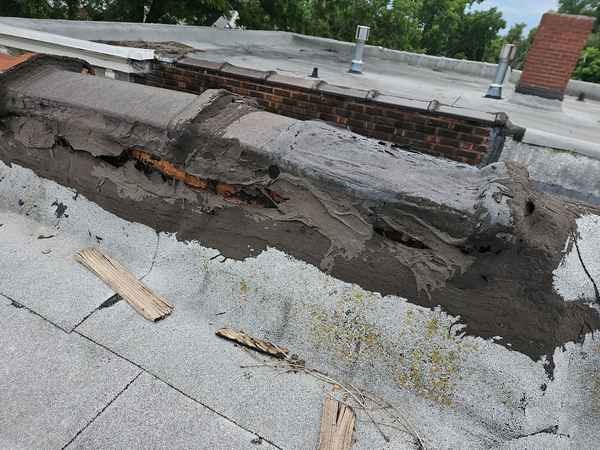 Deteriorated low-slope roof edge found during a multi-family inspection in the Kansas City area