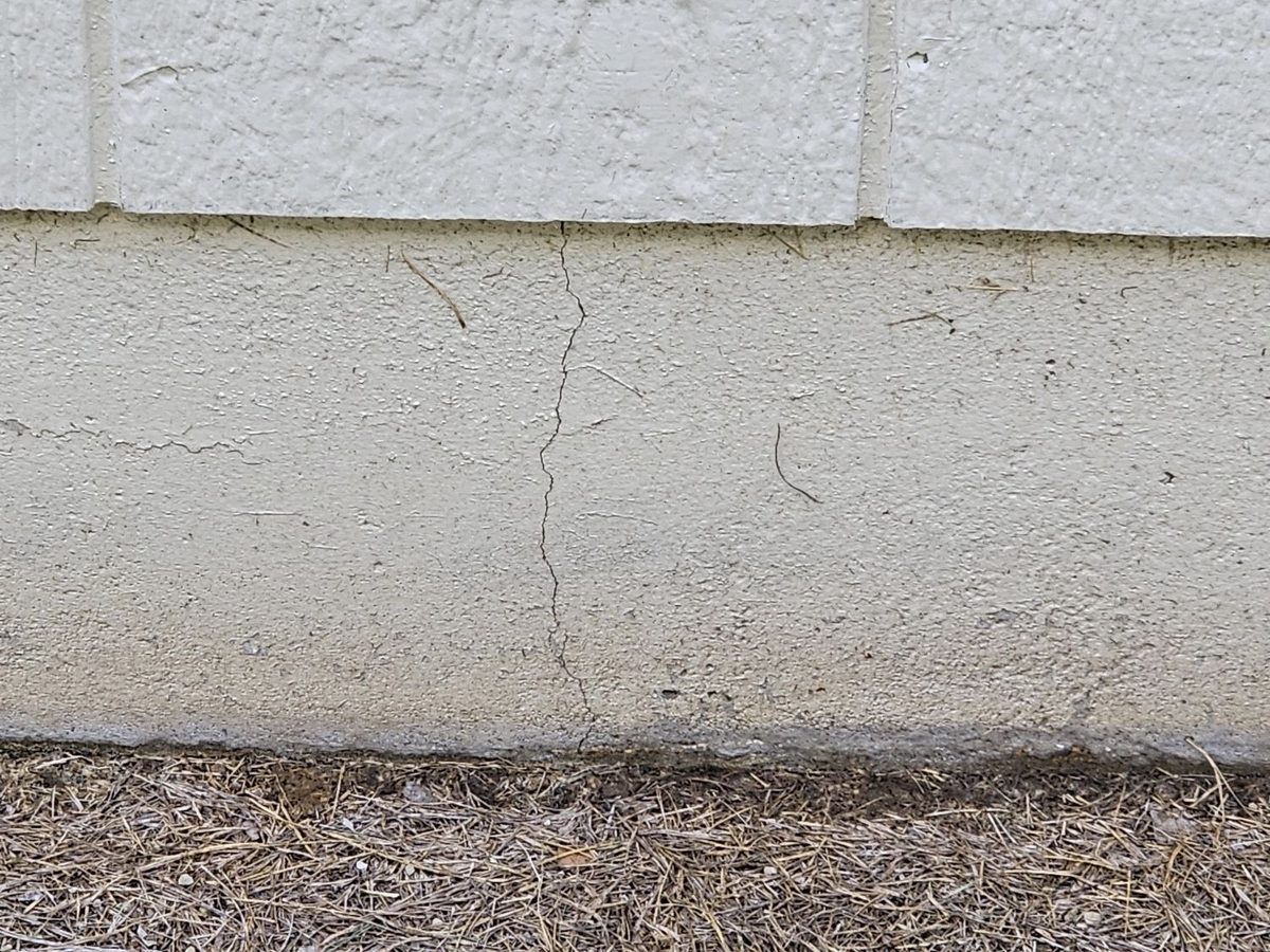 Vertical crack on an exterior concrete foundation wall found during a home inspection in North Kansas City, MO