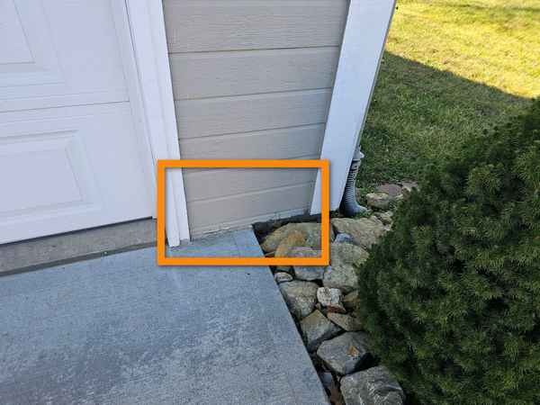 Lower-edge decay on engineered wood siding found during a home inspection in Raymore, MO
