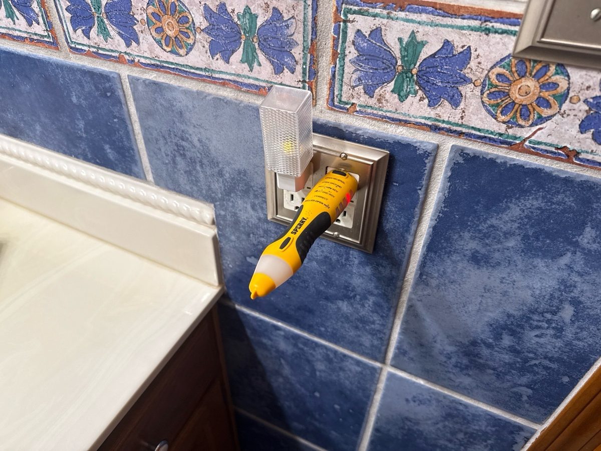 Open ground at a bathroom receptacle found during a home inspection in Raytown, MO