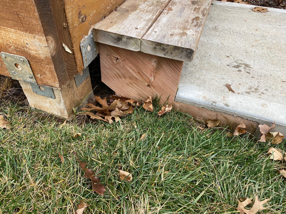 Wood-to-soil contact on a deck step found during a home inspection in Shawnee, KS